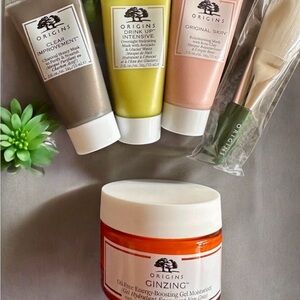 NIB Origins 5 piece set including 1 moisturizer, 3 masks, and 1 applicator brush